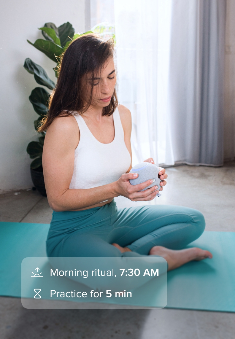 Woman doing meditation with the Orb