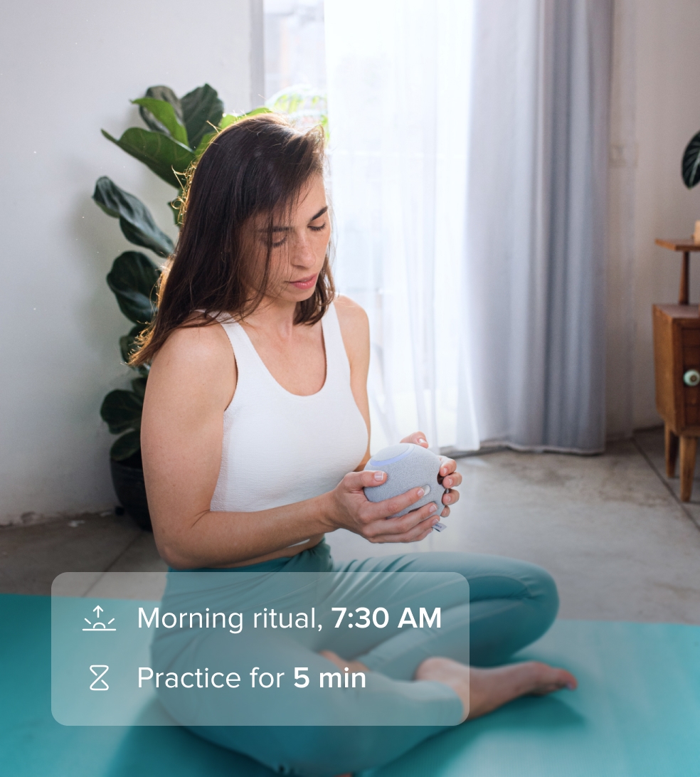 Woman doing meditation with the Orb